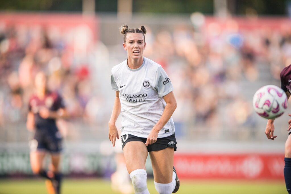 Image of Julie Doyle with her hair in matching pigtails at the back.