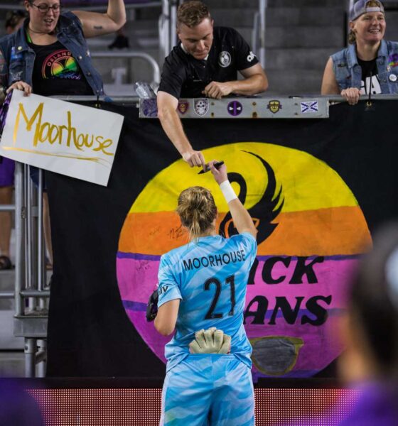Image of Anna Moorhouse meeting with fans after a game.