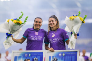 Image of Marta and Angelina being honored before a game.