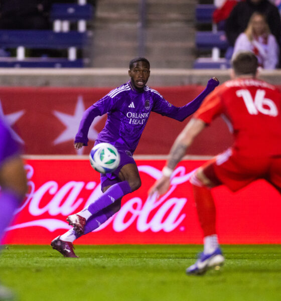 Image of Tyrese Spicer watching the ball approach him against the Chicago Fire.