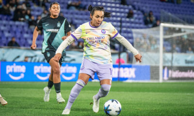 Image of Marta playing the ball against Jess Carter of Gotham FC