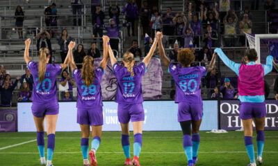 Image of Pride players celebrating with fans.