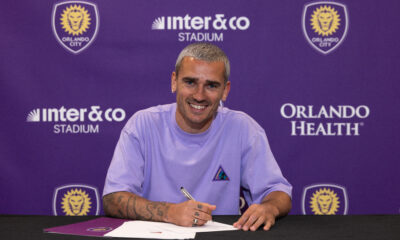 Image of Antoine Griezmann signing his Orlando City contract.