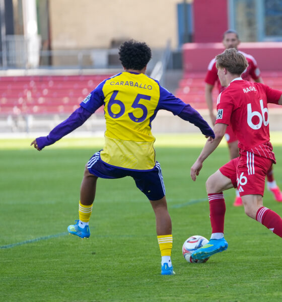 Image of Gustavo Caraballo closing down a Chicago Fire II player.