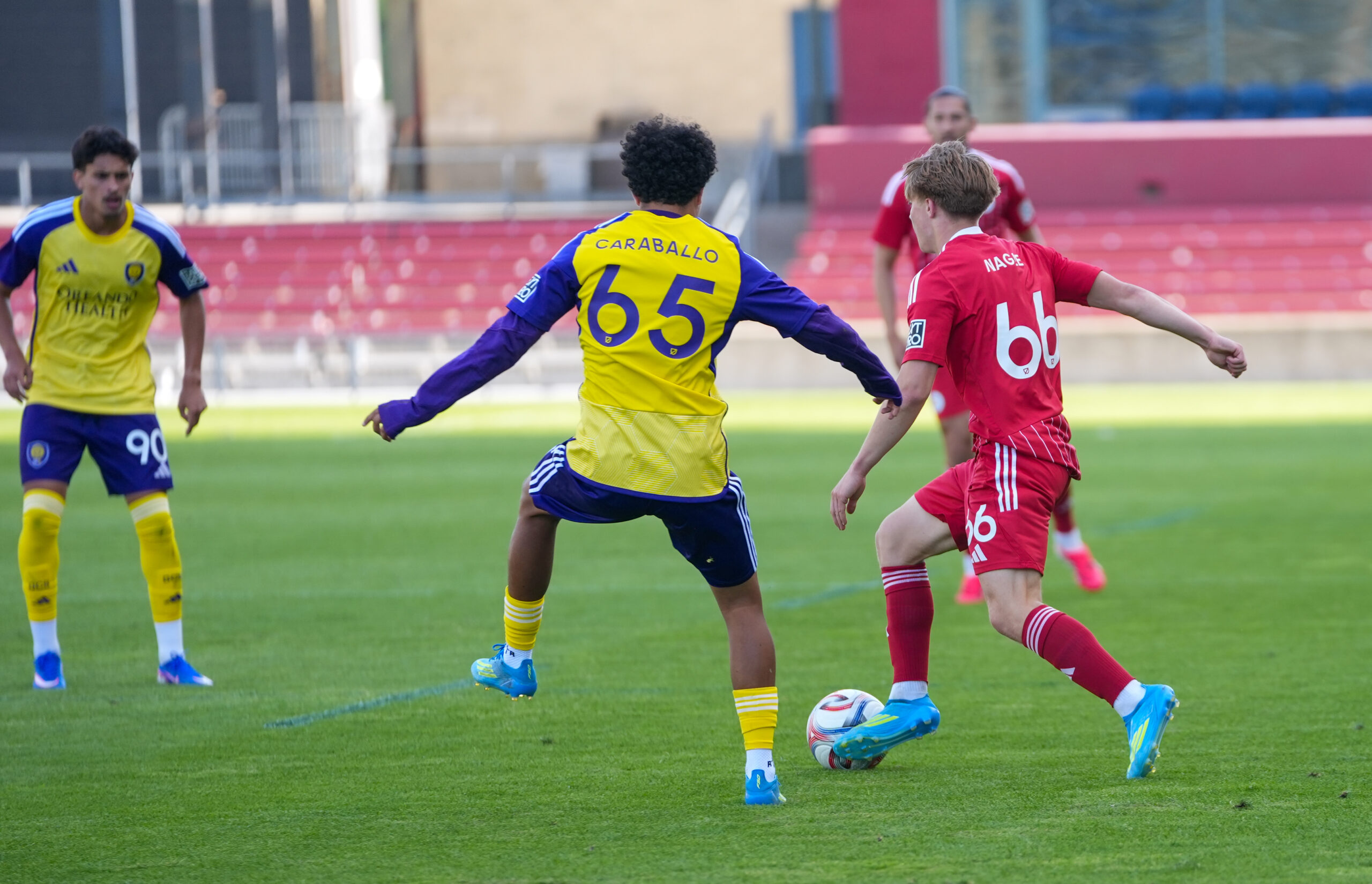 Image of Gustavo Caraballo closing down a Chicago Fire II player.