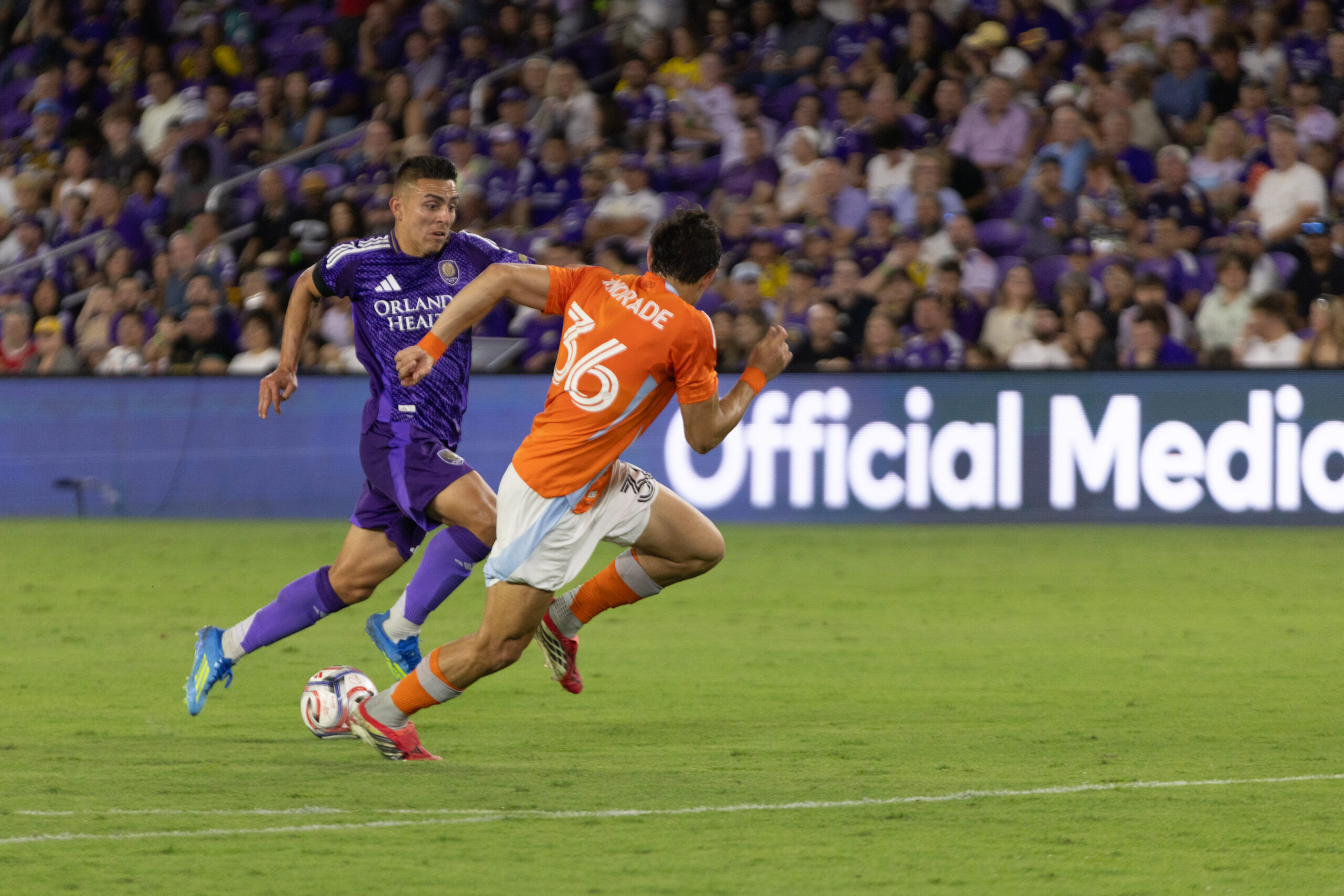 Image of Braian Ojeda trying to dribble past a Houston defender.