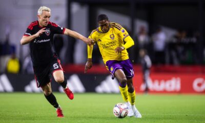 Image of Tyrese Spicer racing past a D.C. player.