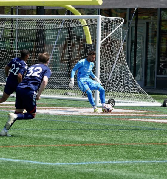 Image of Luca Maxim playing the ball for OCB against New England Revolution II.