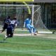 Image of Luca Maxim playing the ball for OCB against New England Revolution II.
