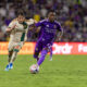 Image of Ivan Angulo racing past an Atlanta defender with the ball.