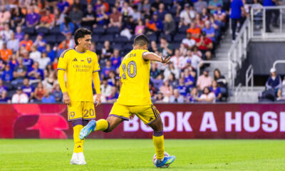 Image of Martin Ojeda taking a free kick against FC Cincinnati as Eduard Atuesta looks on.
