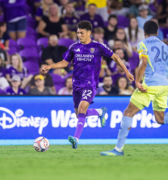 Image of Justin Ellis dribbling the ball trying to beat a Philadelphia Union defender.