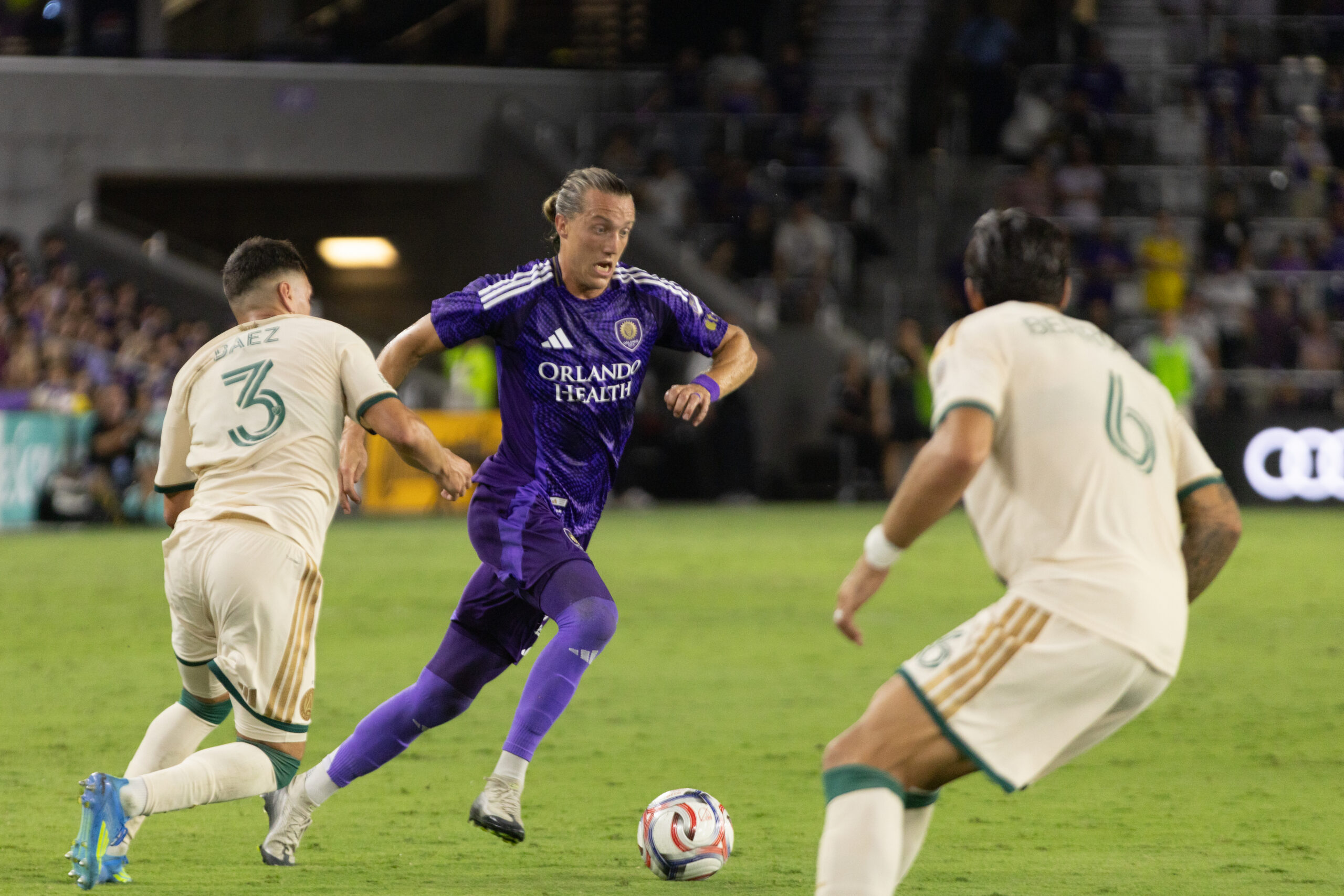 Image of Griffin Dorsey trying to find space against two Atlanta defenders.