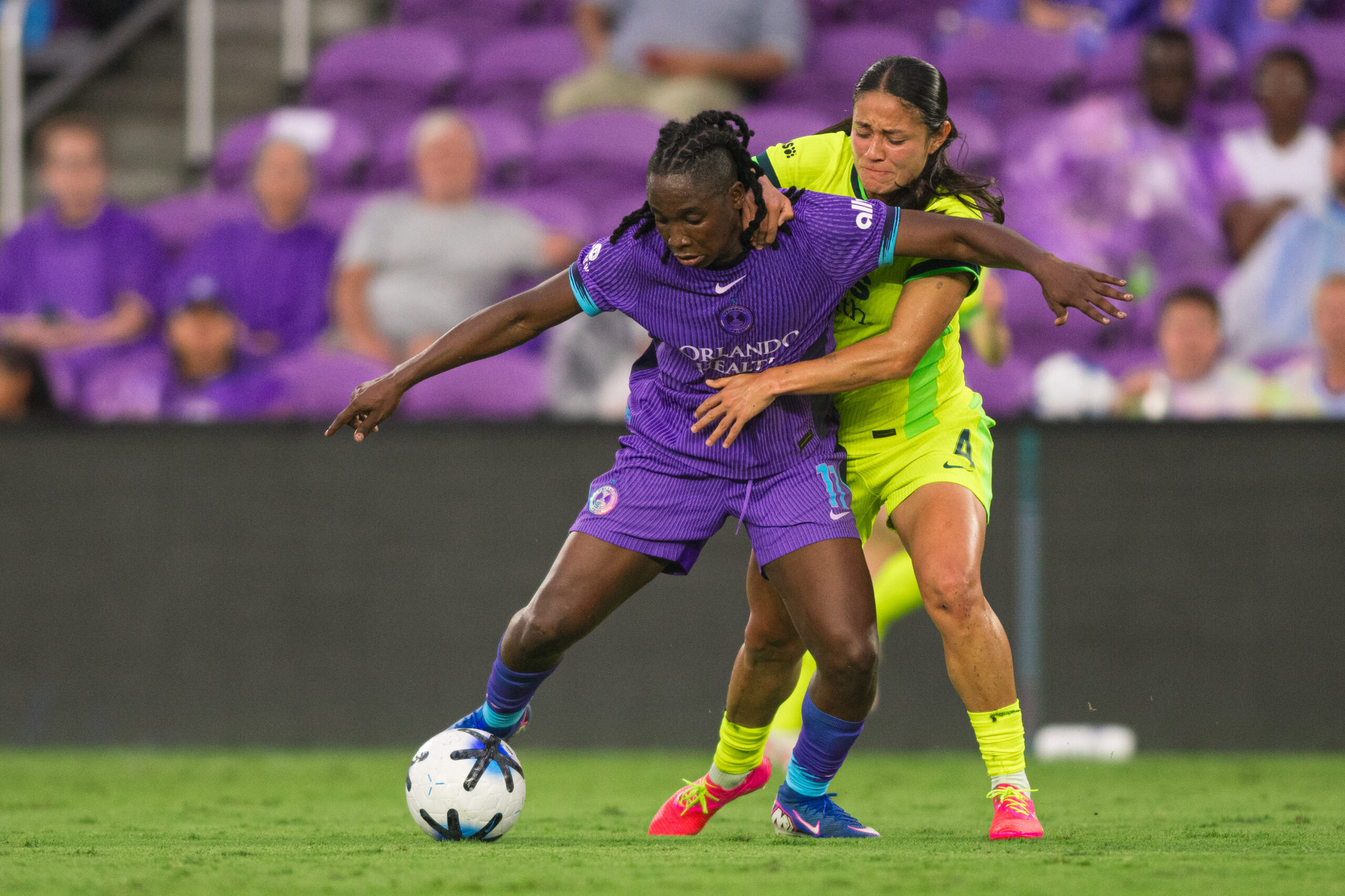 Image of Barbra Banda holding off a Washington Spirit defender.