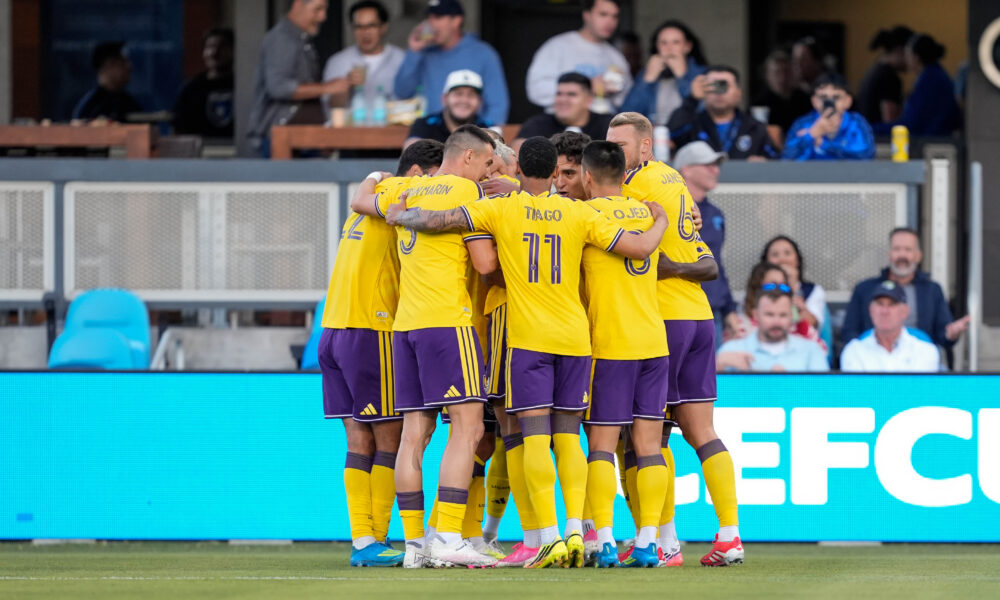 Image of Orlando City players celebrating a goal against San Jose.