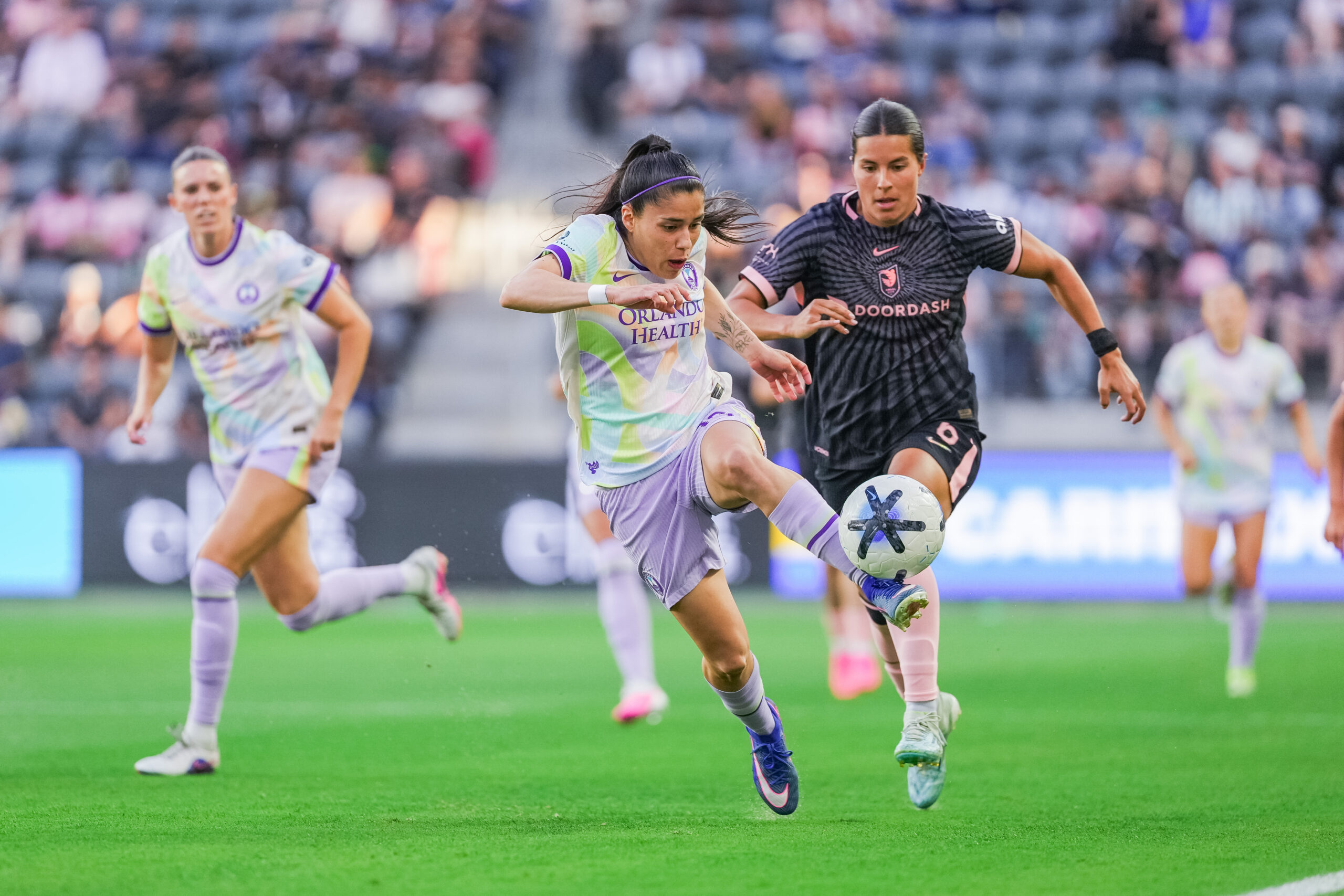 Image of Jacquie Ovalle dribbling the ball against Angel City.