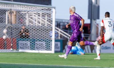 Image of Antoine Griezmann watching his shot go in the net against FC Dallas in a friendly.