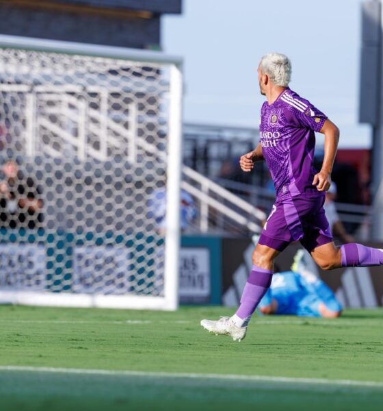 Image of Antoine Griezmann watching his shot go in the net against FC Dallas in a friendly.