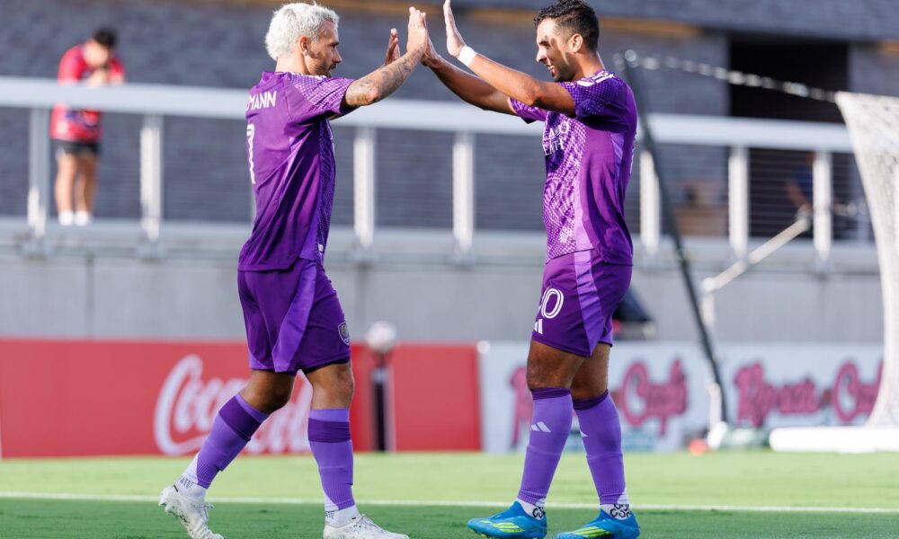 Image of Antoine Griezmann and Martin Ojeda celebrating a goal during Orlando City's 2-1 friendly win at FC Dallas.