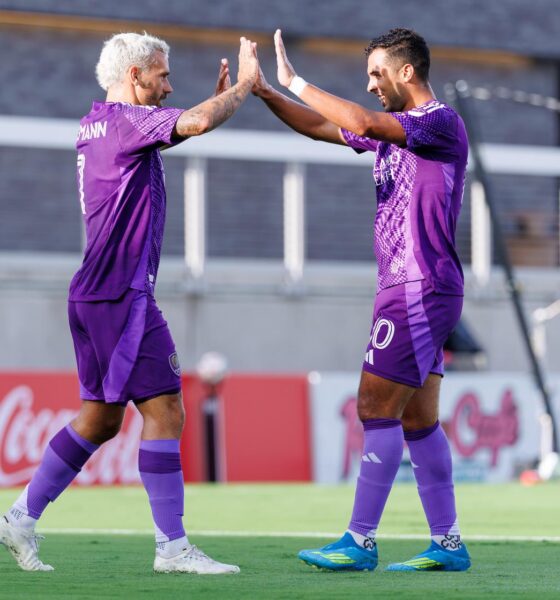 Image of Antoine Griezmann and Martin Ojeda celebrating a goal during Orlando City's 2-1 friendly win at FC Dallas.