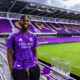 Image of Daryl Dike posing in his Orlando City kit after re-signing with the club on July 17, 2026.