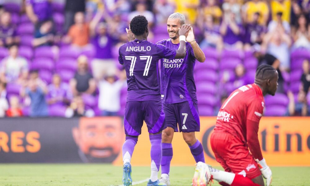 Image of Antoine Griezmann and Ivan Angulo celebrating a goal in a friendly against the Tampa Bay Rowdies.