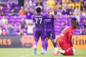 Image of Antoine Griezmann and Ivan Angulo celebrating a goal in a friendly against the Tampa Bay Rowdies.