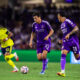 Image of Justin Ellis dribbling the ball with Tiago to his left and Nashville's Hany Mukhtar defending to his right.