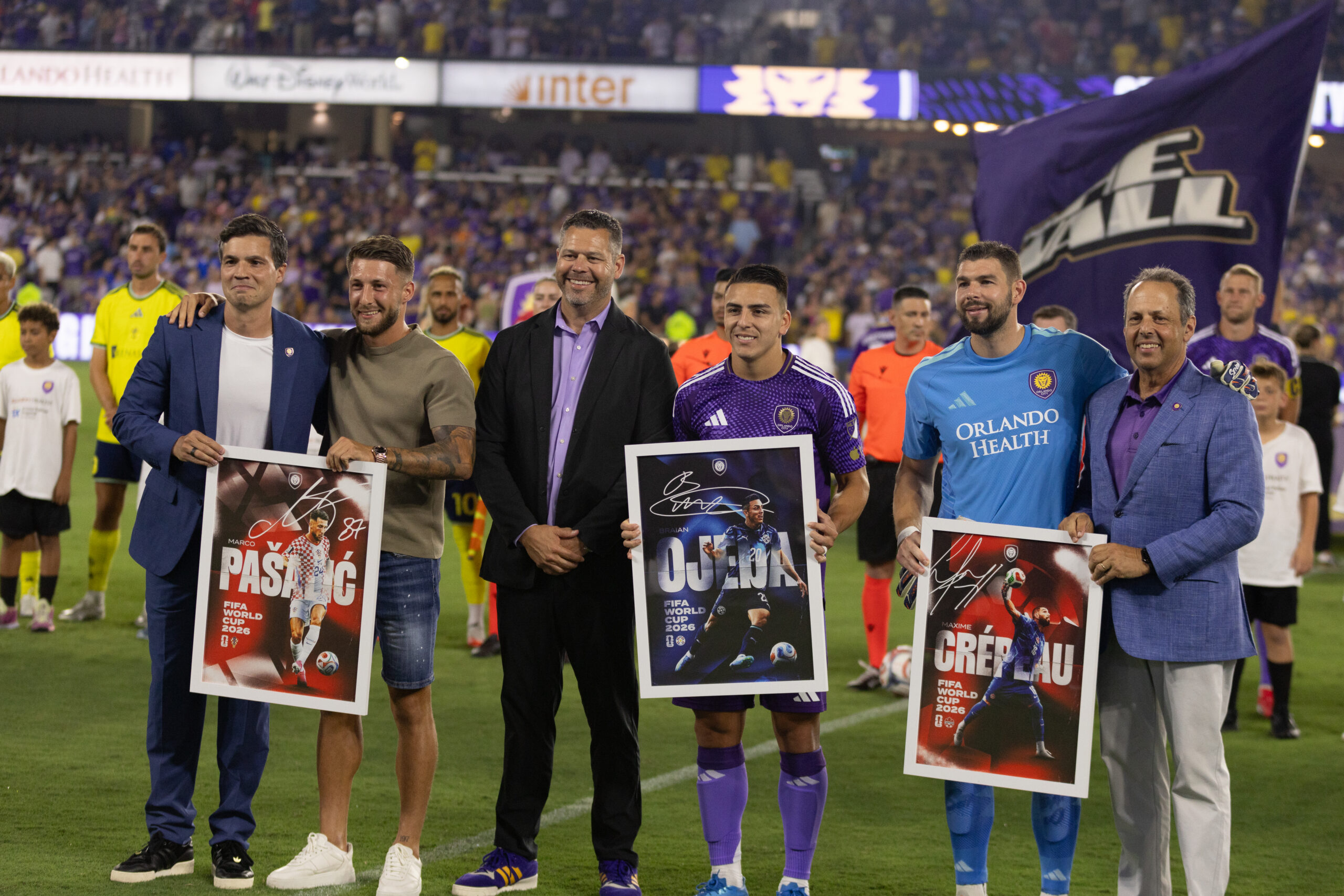 Image of Marco Pasalic, Maxime Crepeau, and Braian Ojeda being honored before a game vs. Nashville for their participation in the 2026 FIFA World Cup.