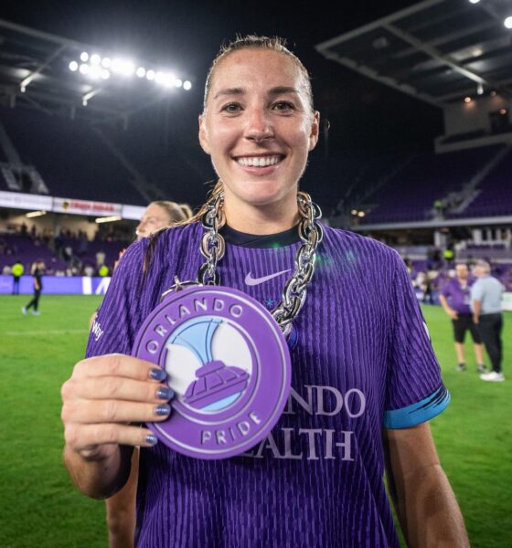 Image of Hannah Anderson posing with her Pride Player of the Match chain.
