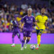 Image of Antoine Griezmann dribbling the ball past Hany Mukhtar of Nashville.
