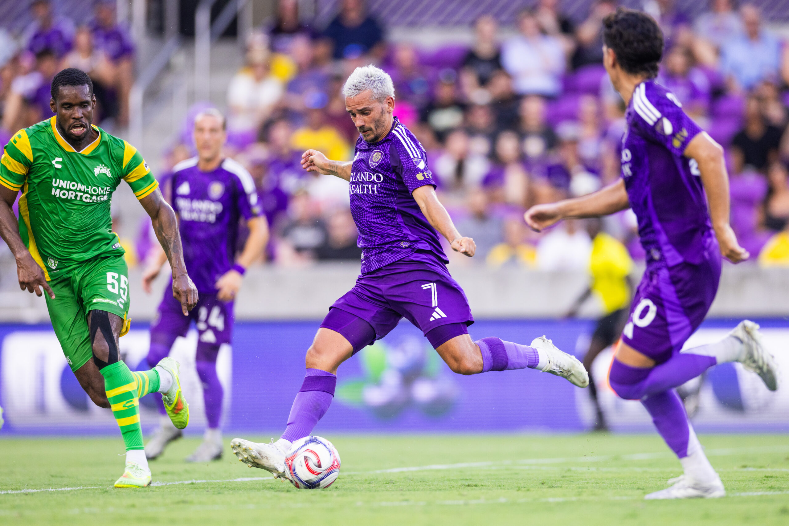 Image of Antoine Griezmann firing a shot in a friendly against Tampa Bay.