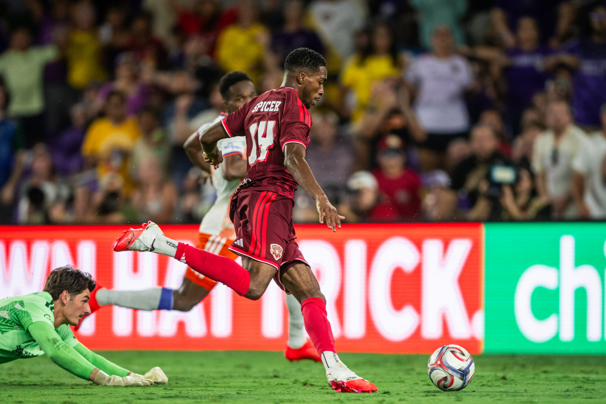 Image of Tyrese Spicer rounding the goalkeeper against Cincinnati.