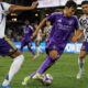 Image of Justin Ellis slicing between two Real Salt Lake defenders.