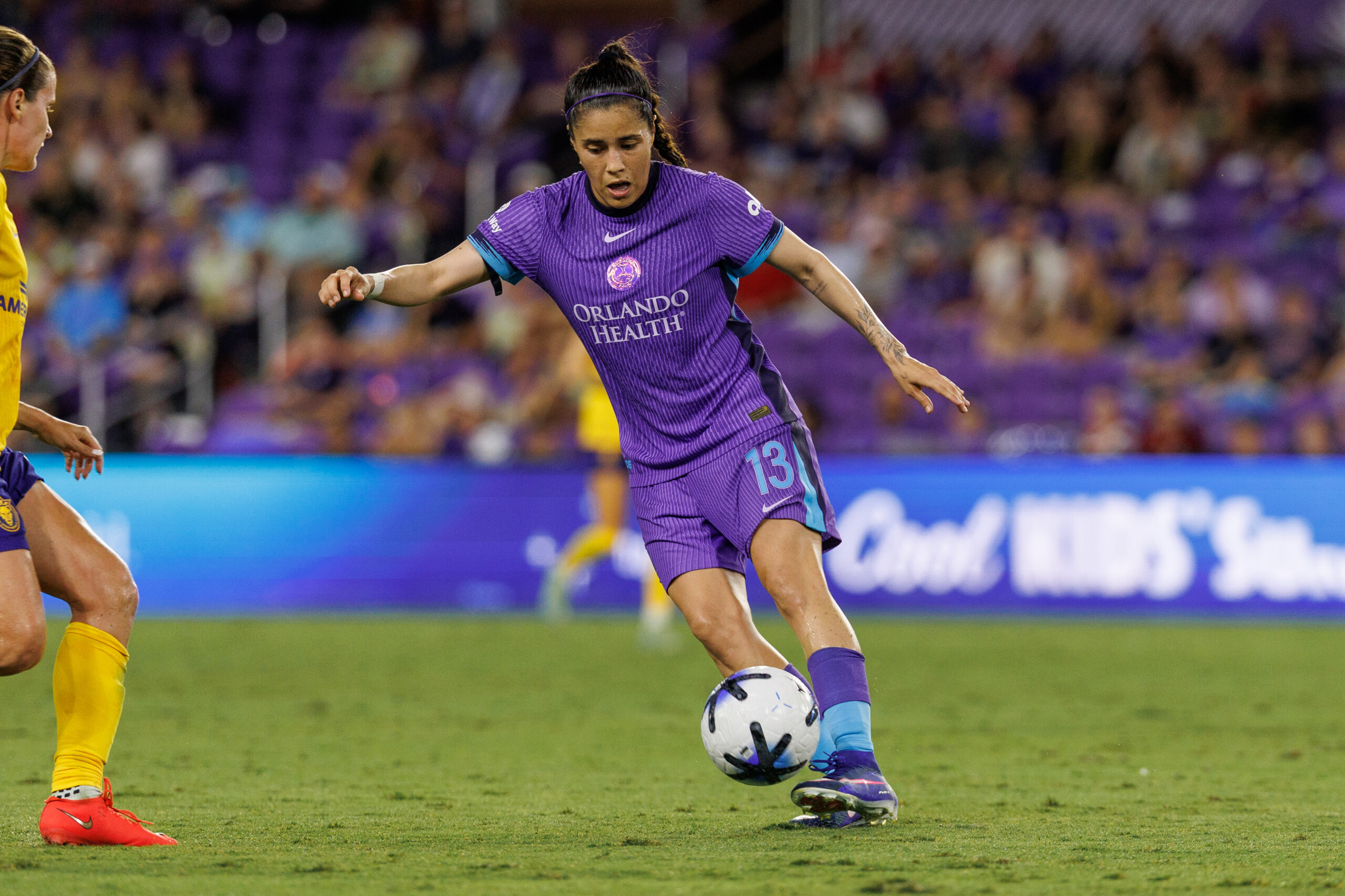 Image of Jacquie Ovalle with the ball against Utah.