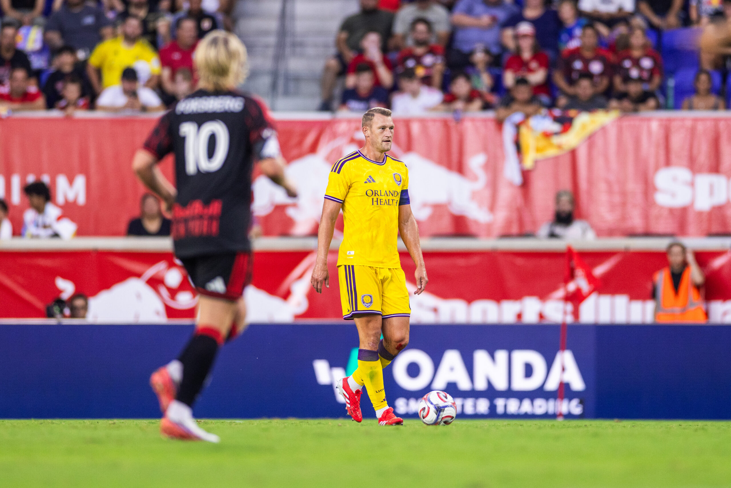 Image of Robin Jansson looking for passing options against the New York Red Bulls.