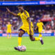 Image of Tyrese Spicer looking to cross the ball against New York.