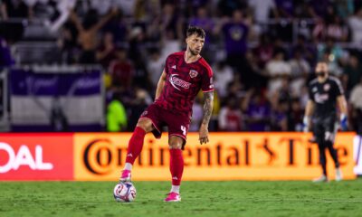 Image of David Brekalo standing over the ball.