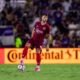 Image of David Brekalo standing over the ball.