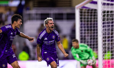 Image of Antoine Griezmann and Justin Ellis celebrating a goal against Real Salt Lake.