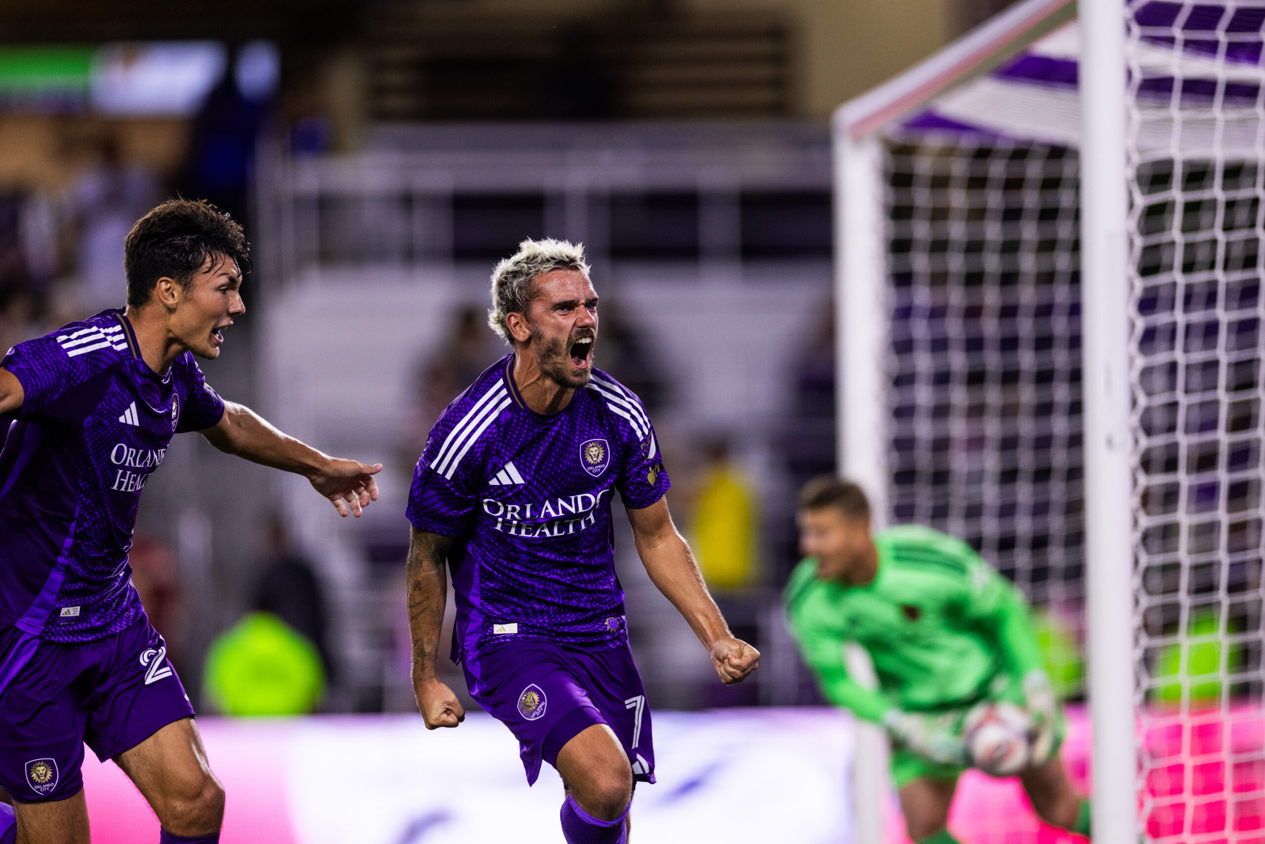Image of Antoine Griezmann and Justin Ellis celebrating a goal against Real Salt Lake.