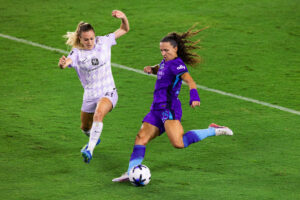 Image of Kerry Abello taking a shot against Racing Louisville.