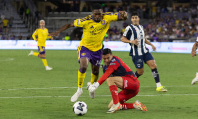 Image of Tyrese Spicer being fouled by Monterrey goalkeeper Luis Cardenas.