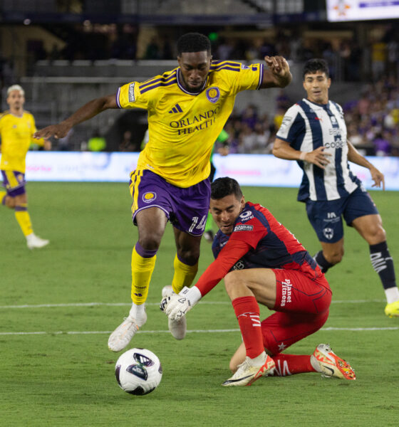 Image of Tyrese Spicer being fouled by Monterrey goalkeeper Luis Cardenas.