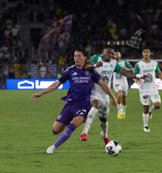 Image of Harvey Sarajian getting elbowed in the neck by Juan Guevara of Club Leon