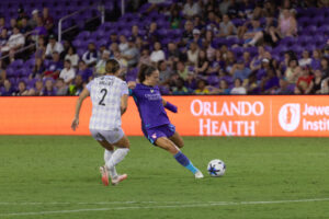 Image of Kerry Abello taking a shot against Louisville.