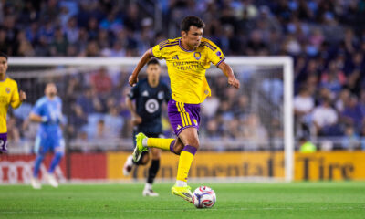 Image of Justin Ellis dribbling the ball upfield against Minnesota.