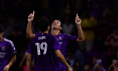Image of Harvey Sarajian celebrating his goal with Zakaria Taifi.