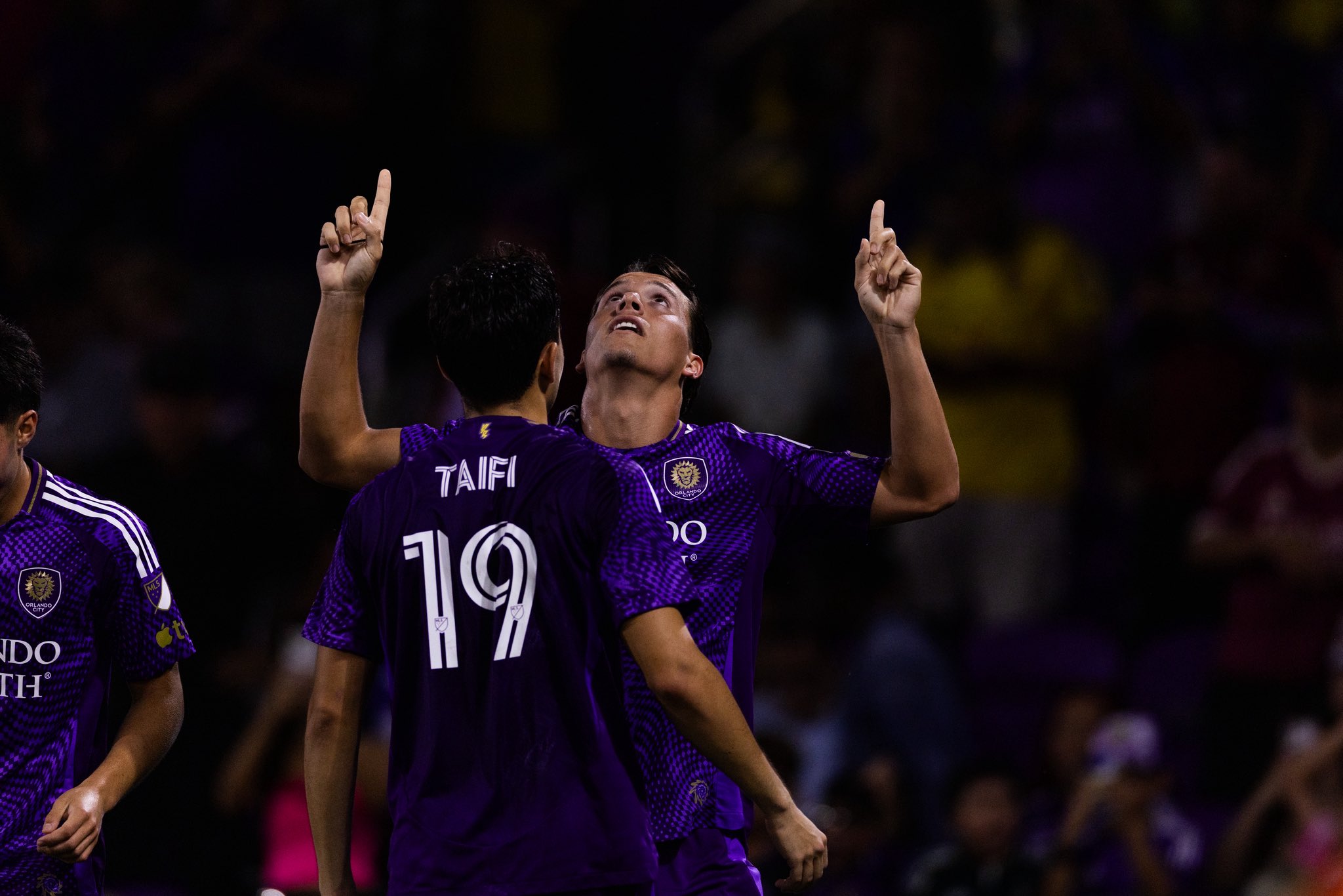 Image of Harvey Sarajian celebrating his goal with Zakaria Taifi.