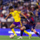 Image of Justin Ellis holding off a New England defender.